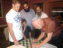 Boris Gulko, a former Soviet refusenik, who is a Chess Grandmaster, joined us for a Shabbat. Here, he signs a chessboard (before Shabbat) for Chabad board member Eli Klarman