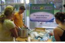 Josh serves matzah ball soup to freshmen at Monroe Hall