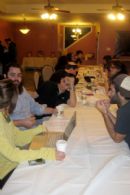 The semester ends with finals, and students crowd into the Chabad House during midnight breakfast, to get a bit of food which will sustain them through the night of studying.