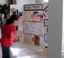 Visitors persuse the plans for the new center. 